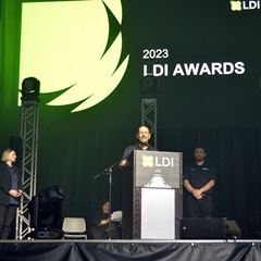 Gary Vilardi accepting the Widget Award for Wing Nut Socket at LDI 2023
